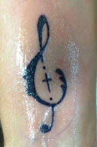 a-new-song-to-sing, Rebekah-Gilbert, treble-clef-tattoo, cross