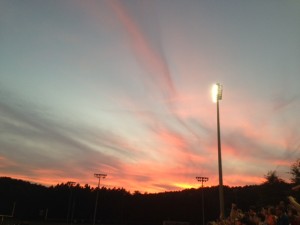 flaming sunset, football field,
